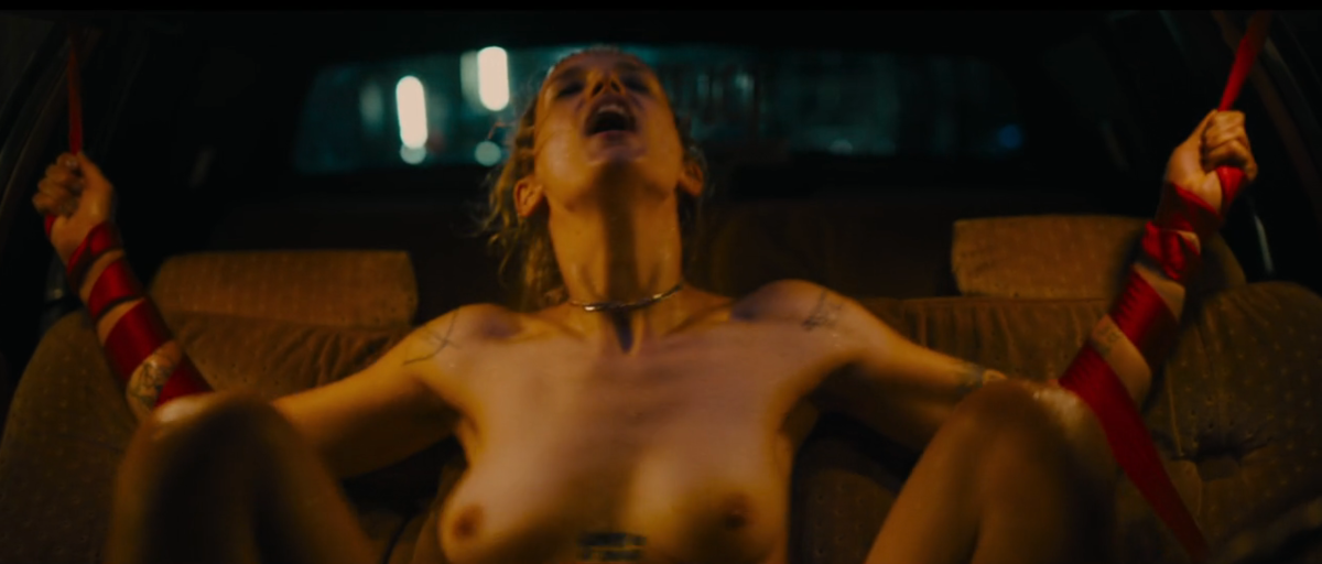 Alexia having sex with a car in Titane